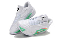 Pair of white Jordan Luka 3 basketball shoes with mint green and bright pink accents