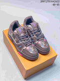 Pair of dark brown Louis Vuitton Trainer low-top sneakers with multicolor motifs displayed on an orange box; image text shows 2607 TYD1642A22 and 40–45.