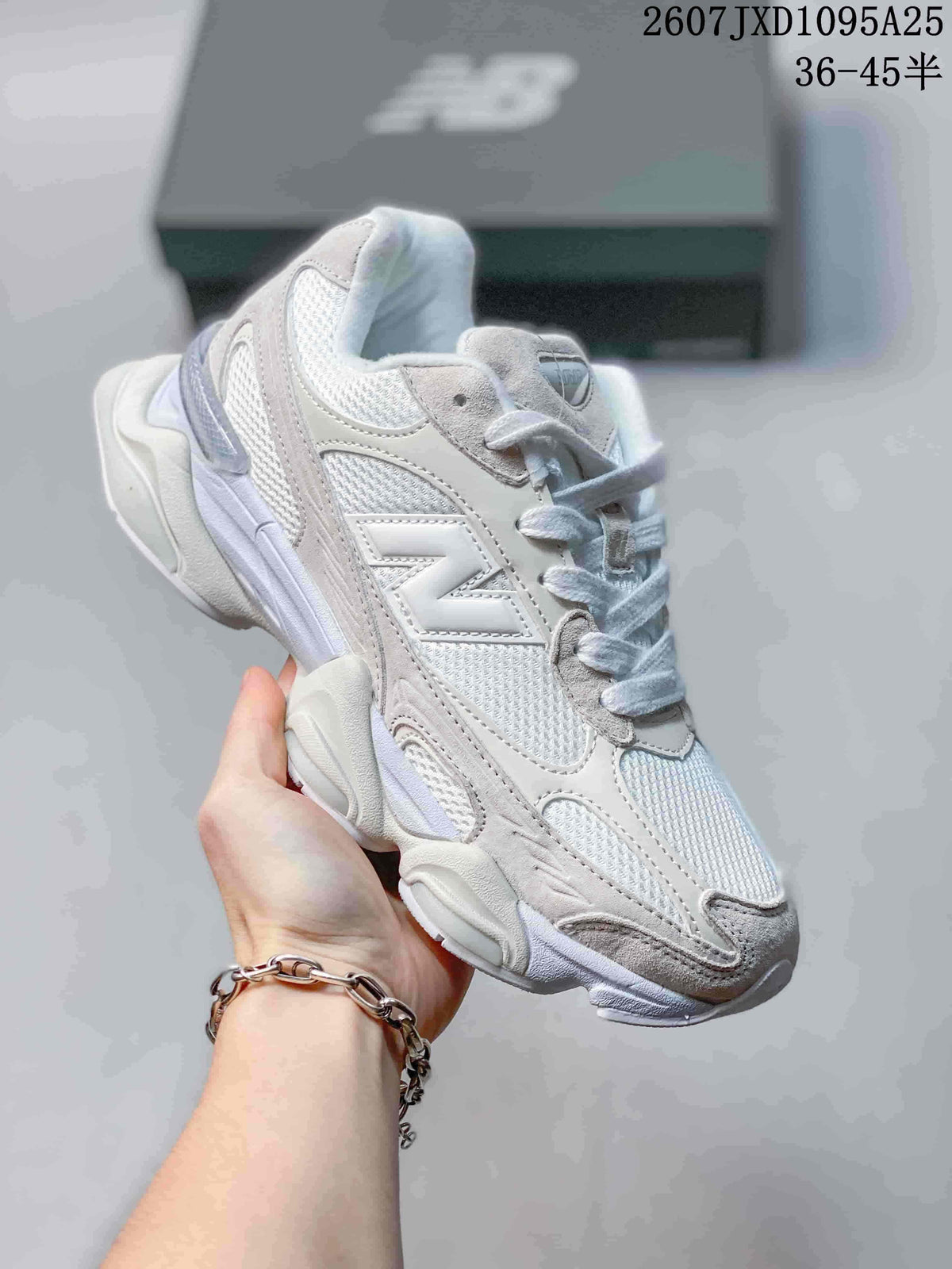 Angled side view of one light-colored New Balance 9060R sneaker with a large side logo.