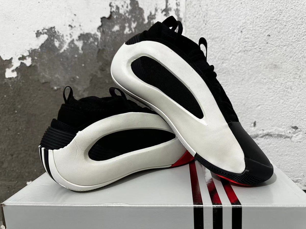 Basketball shoes arranged to show their side profile and outsole