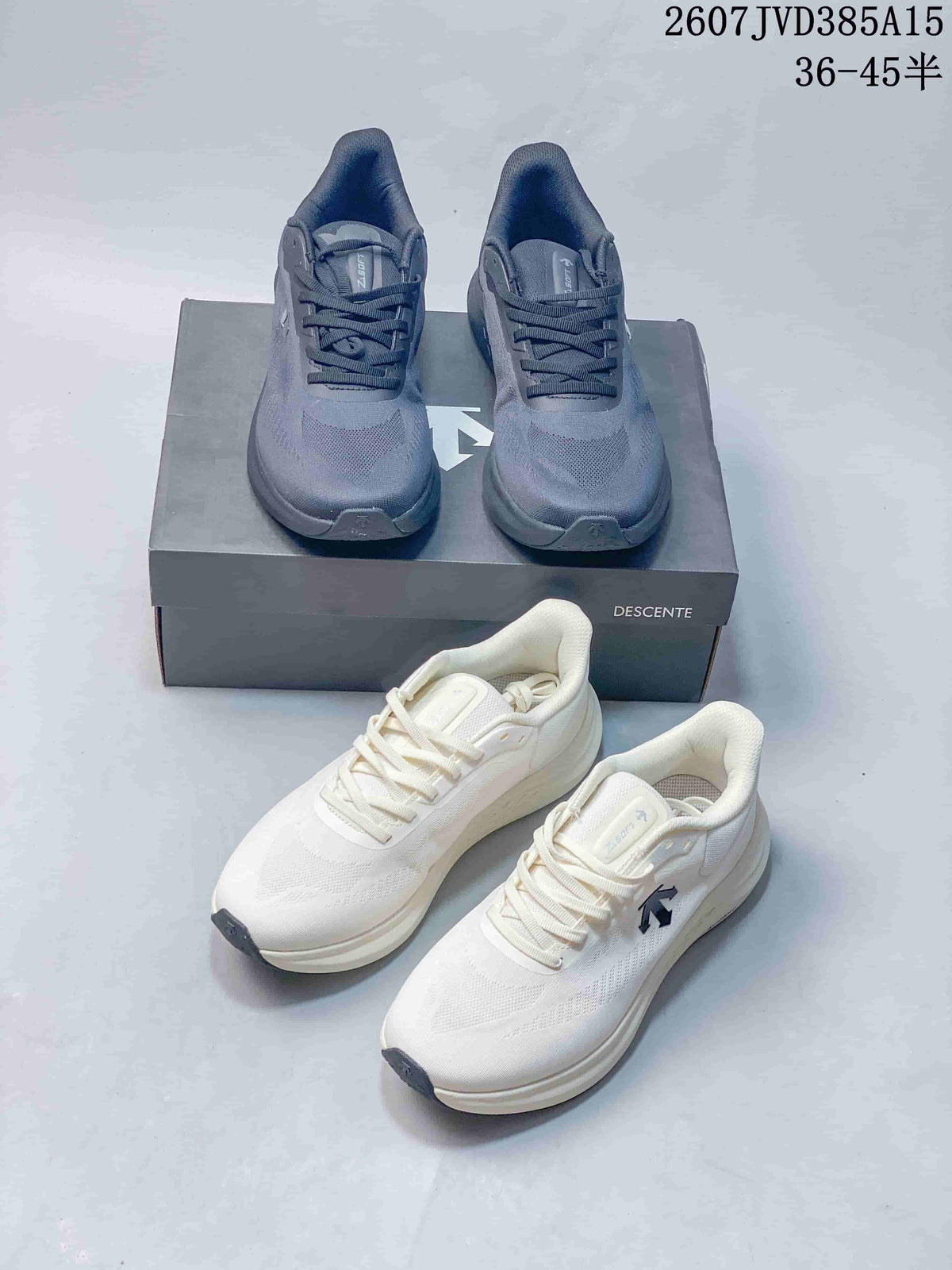 Grey and white pairs of Descente EASE WIRE sneakers arranged together with a Descente shoe box.