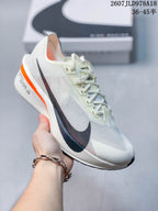 Light-colored Nike racing sneaker with a black side Swoosh and orange sole accent; image text shows style code 2607JLD978A18 and size range 36–45.