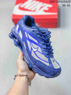 Angled side view of the blue and white sneaker showing layered overlays, Nike branding and the segmented blue sole.