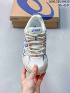 Top view of the sneaker showing the lace-up construction, mesh-like upper, and ASICS tongue branding.