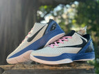 Pair of white, blue, and pink Kobe 6 basketball shoes in an angled view.