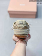 Rear view of the beige sneaker showing layered heel panels, mesh detailing, and Miu Miu branding on the tongue; image text shows 2607TYD622A22 and 36–45.