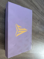 Light purple shoe box with a gold-colored basketball logo