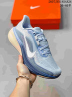 Angled side view showing the breathable-looking upper, white Swoosh, and layered sole.
