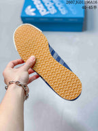 Bottom view showing the gum-colored outsole with a repeating textured tread pattern.