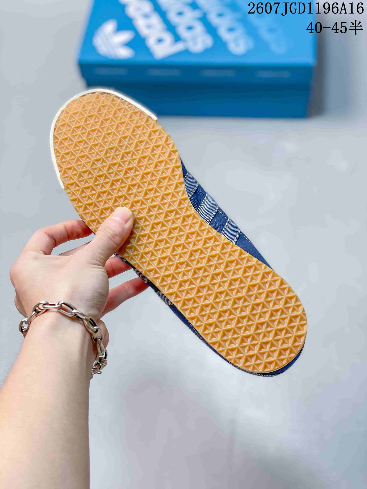 Bottom view showing the gum-colored outsole with a repeating textured tread pattern.
