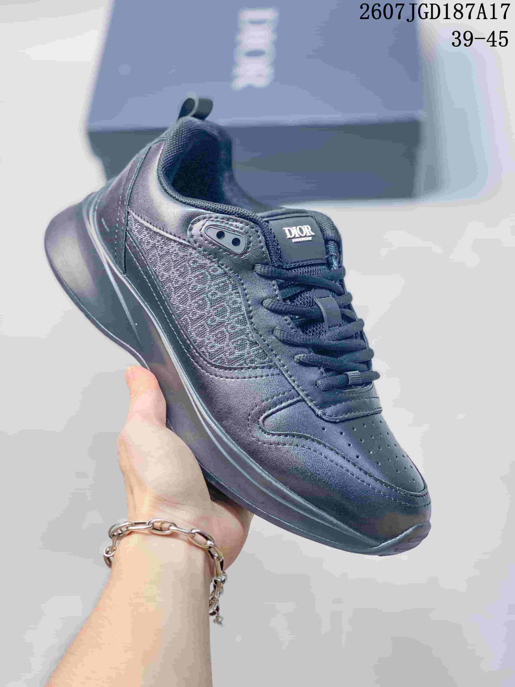 Dark gray Dior B25 Runner sneaker with a tonal patterned side panel and dark outsole.