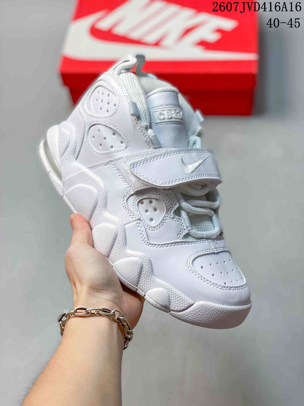 All-white Nike high-top sneaker with perforated panels, laces and a hook-and-loop strap; style code 2607JVD416A16 and size range 40–45 are overlaid.