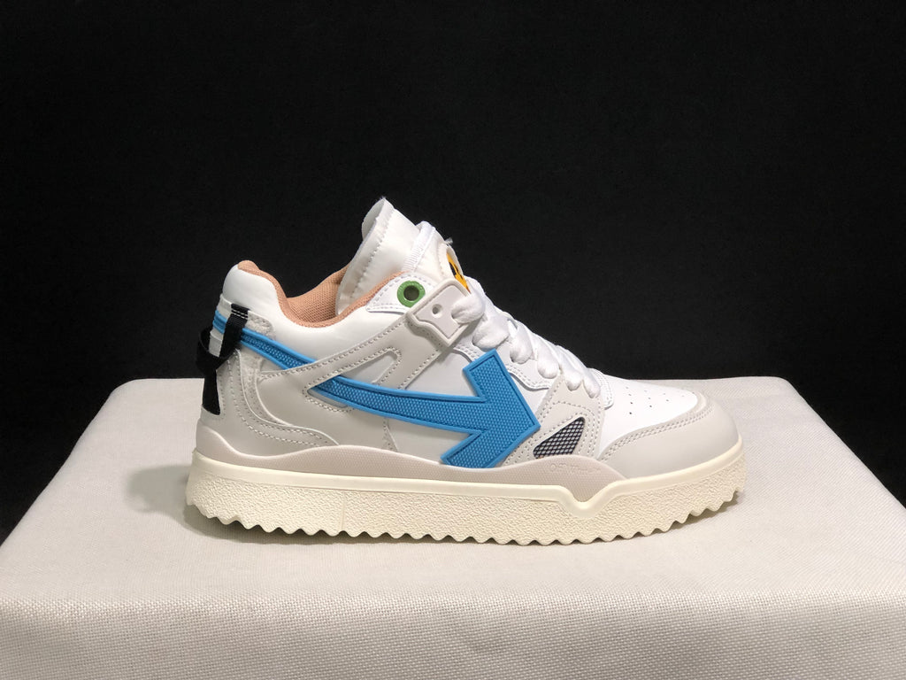 Opposite side profile showing the blue arrow detail, black heel pull element, and white layered upper.