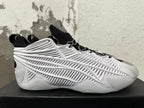 Side profile showing the white sculpted cage panels and black upper
