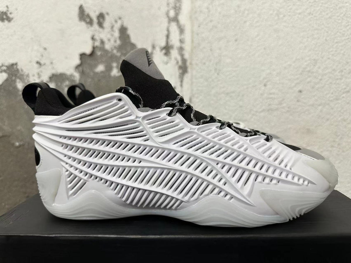 Side profile showing the white sculpted cage panels and black upper