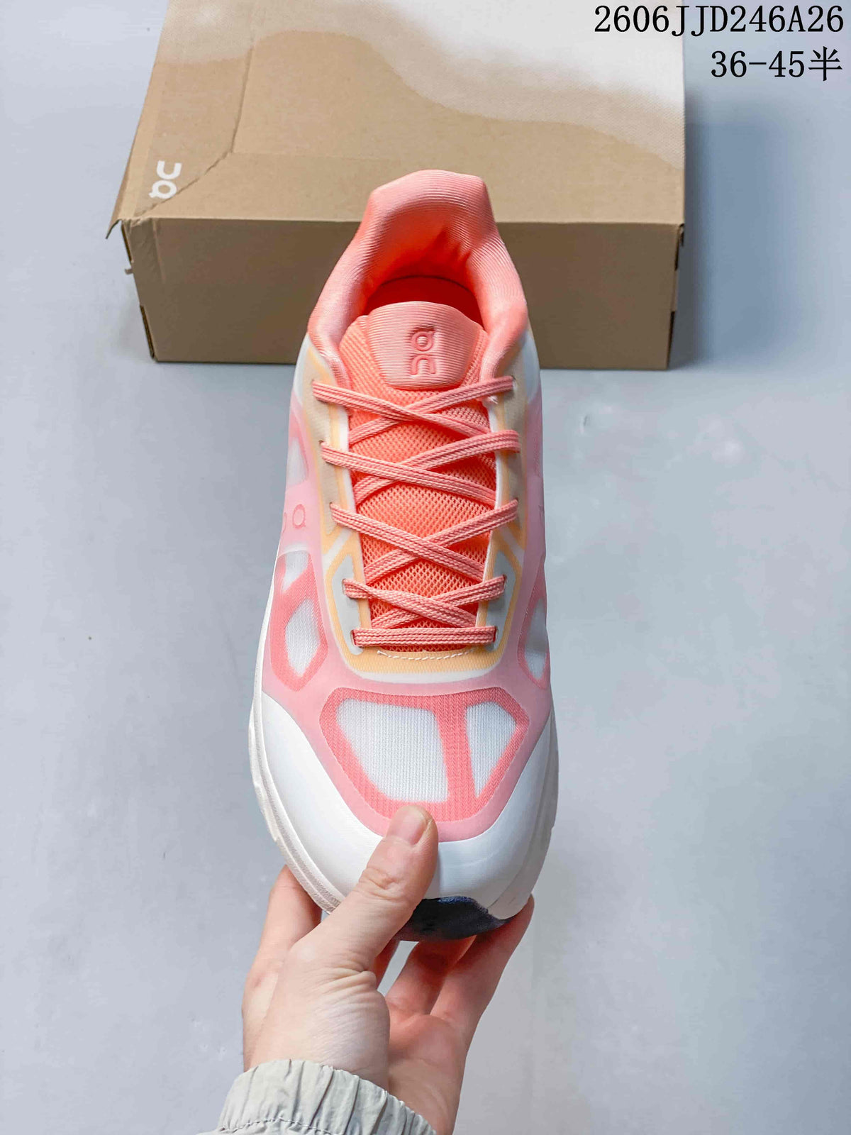 Top view showing the coral laces, padded tongue, and pink-and-white toe design.