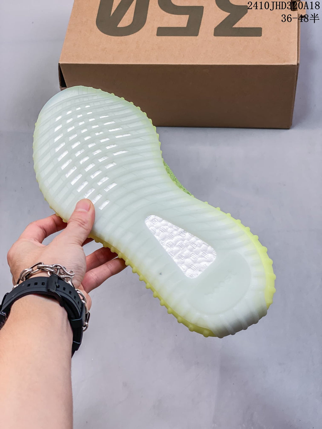 Translucent ribbed outsole of the sneaker shown from below.