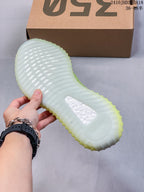 Translucent ribbed outsole of the sneaker shown from below.