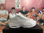 Side profile of a white Jordan sneaker showing layered panels, textured upper sections, heel detailing, and a visible heel air window.