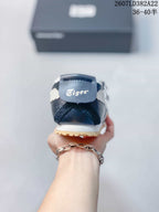 Rear view of the navy sneaker showing the Tiger heel tab, white side detailing and gum outsole edge.