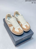 Pair of cream and tan ECCO sneakers displayed on a branded shoe box.