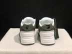 Rear view showing padded heel panels, printed heel details, and the dark outsole edge.