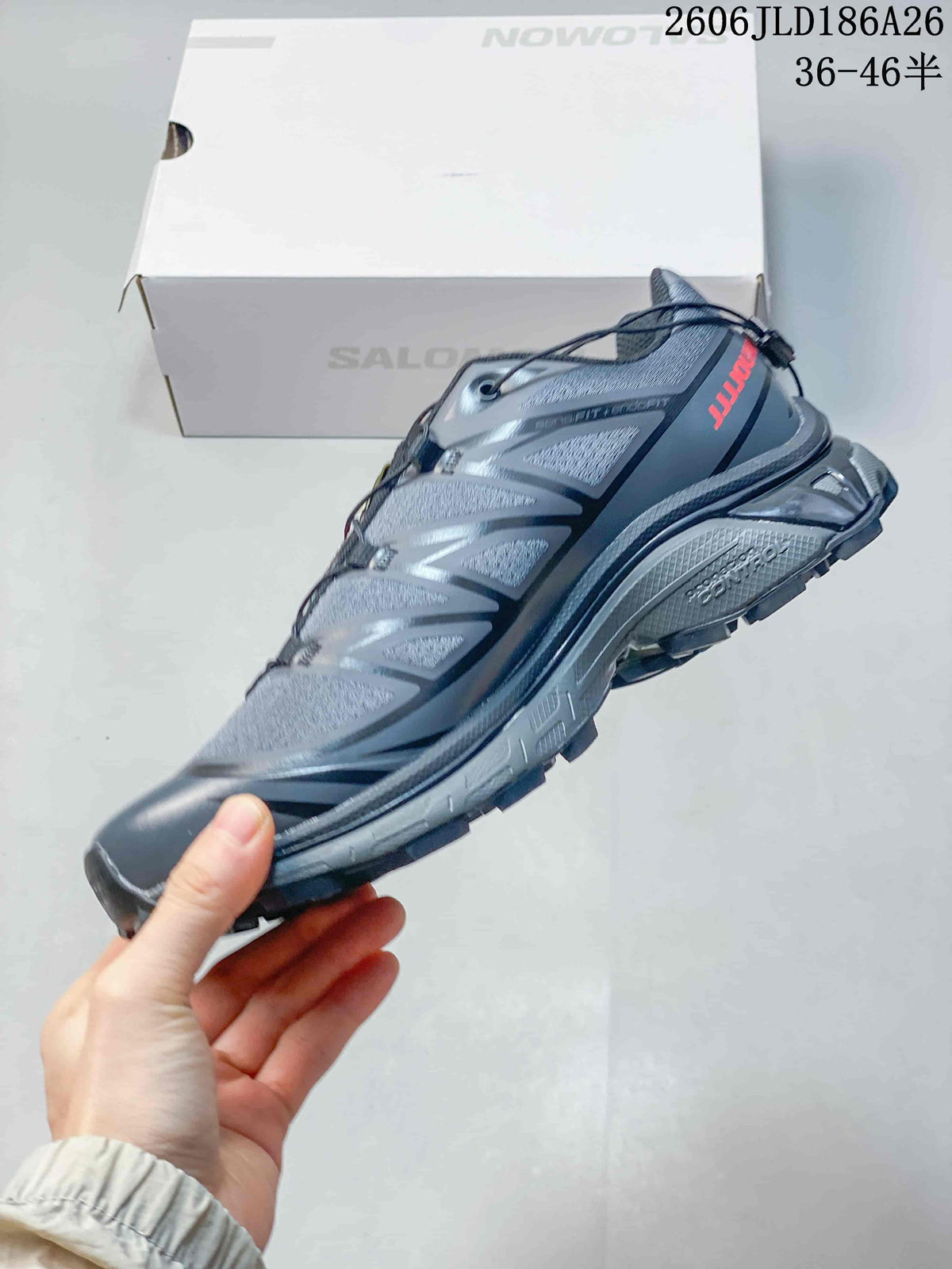 Side view of the gray low-top shoe with camouflage-style panels and quick laces