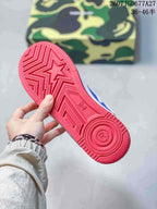 Close-up of the red rubber outsole showing geometric traction grooves and a circular heel pattern.