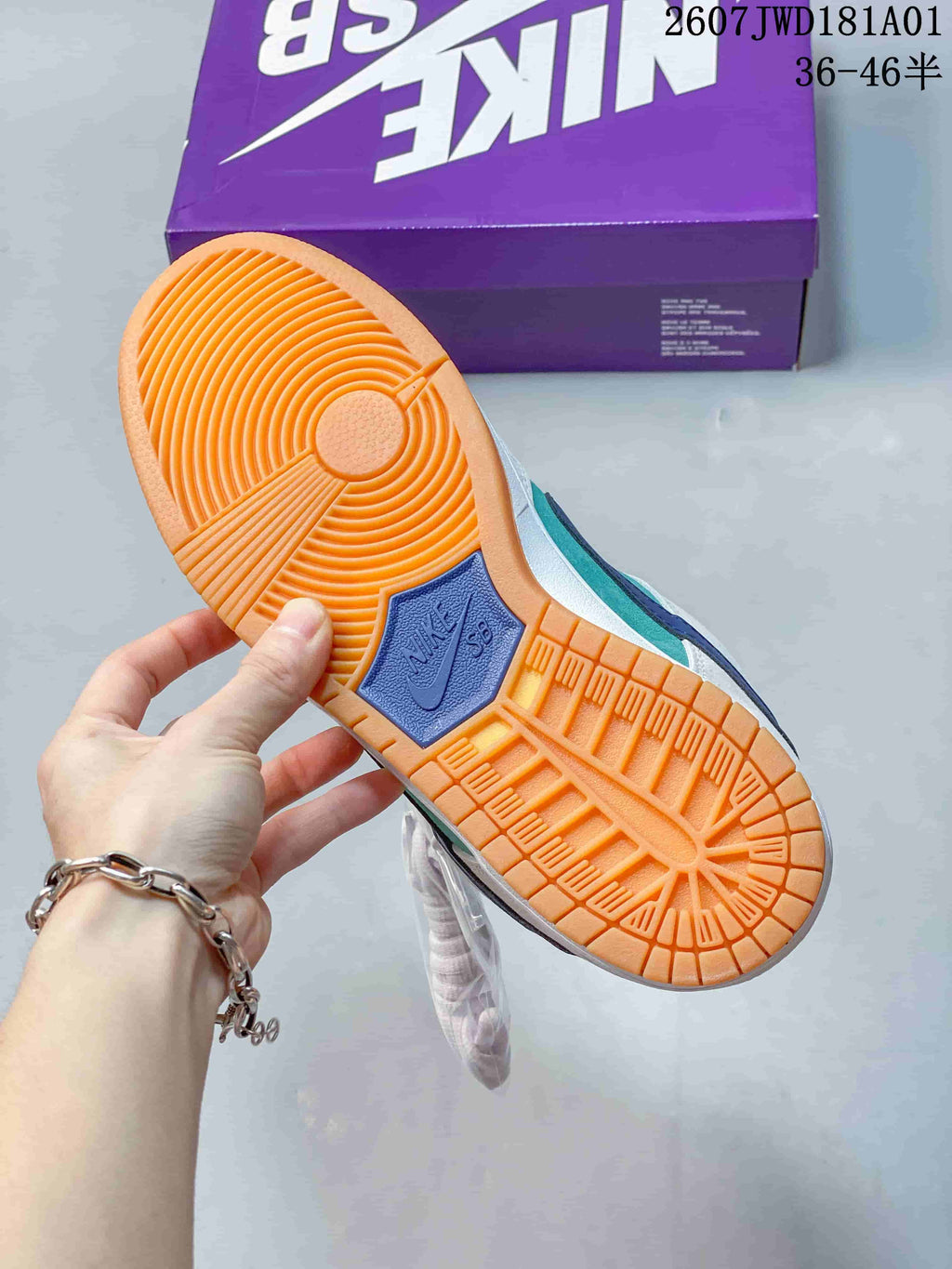 Close-up of the gum-colored outsole and tread on a Nike SB Dunk Low Pro sneaker.