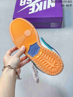 Close-up of the gum-colored outsole and tread on a Nike SB Dunk Low Pro sneaker.