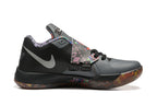 Side view of a gray and black Nike KD 4 shoe with a patterned strap and outsole.