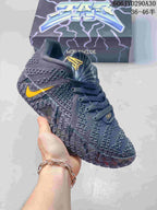Dark gray Nike Ja 3 basketball shoe with yellow accents