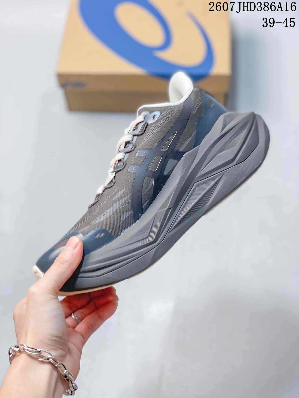 Side profile of the dark gray and navy low-top sneaker with layered sole details.