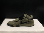 Side profile showing the black Swoosh, olive upper, padded collar, and raised outsole structure.