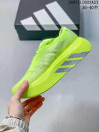 Side view showing the mesh-like upper panels and gray outsole stripe details.