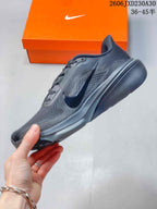Side profile of a dark gray running shoe with a contrasting Swoosh.