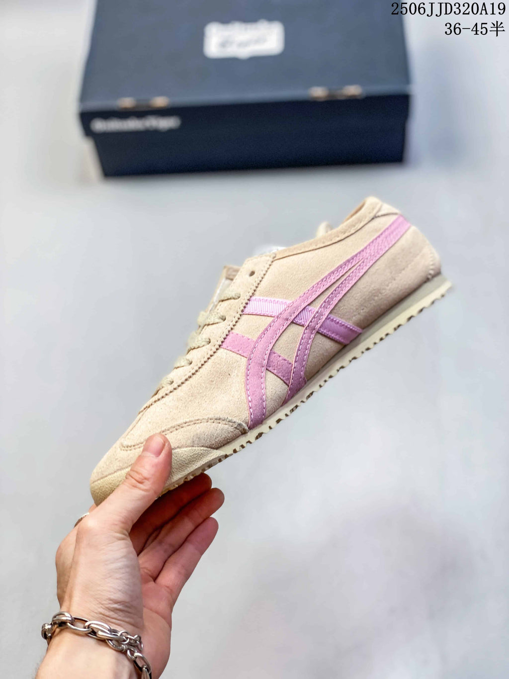 Side profile showing the beige upper, layered pink side stripes, lace-up front, and low sole.