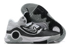 Gray, white, and black Nike KD basketball shoes with a patterned outsole.
