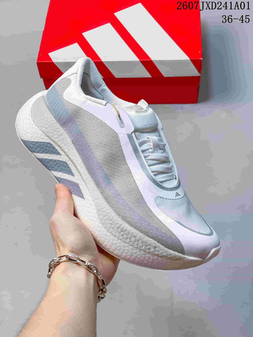 Gray and white adidas Hyperboost Edge M running shoe shown from the side.