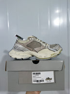 Beige and grey sneaker displayed on its shoebox; the label shows Stapler, 9191, and EU size 39.