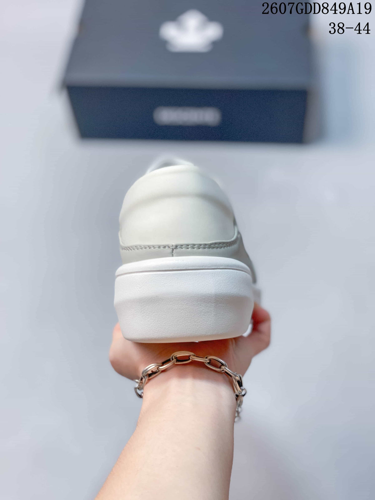 Rear view of the sneaker showing the padded heel area and raised white outsole.