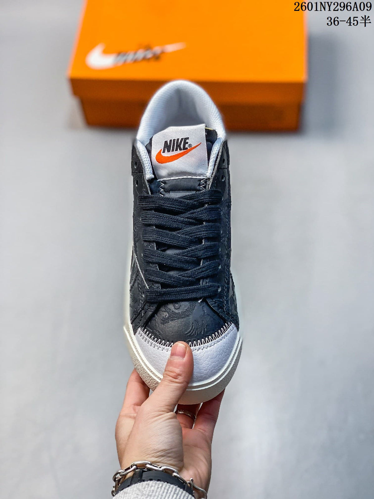 Top view showing the black laces, padded tongue, white toe cap, and contrast stitching.