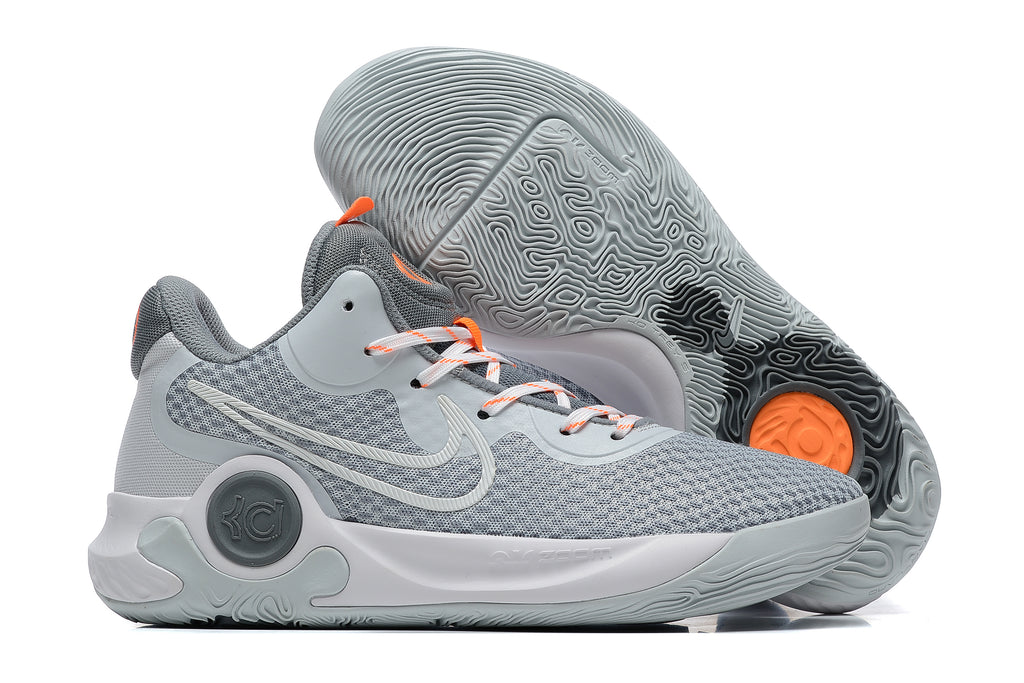 Gray Nike KD basketball shoe with orange lace accents and gray patterned outsole.