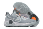 Gray Nike KD basketball shoe with orange lace accents and gray patterned outsole.
