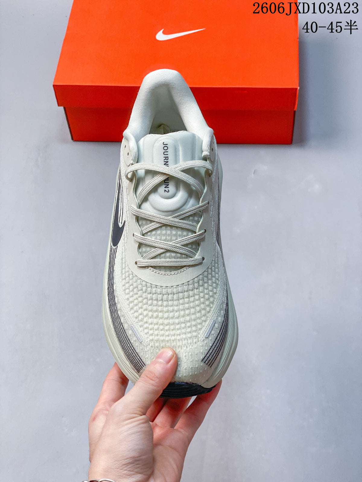 Top view showing the mesh-look upper, laces, and tongue label