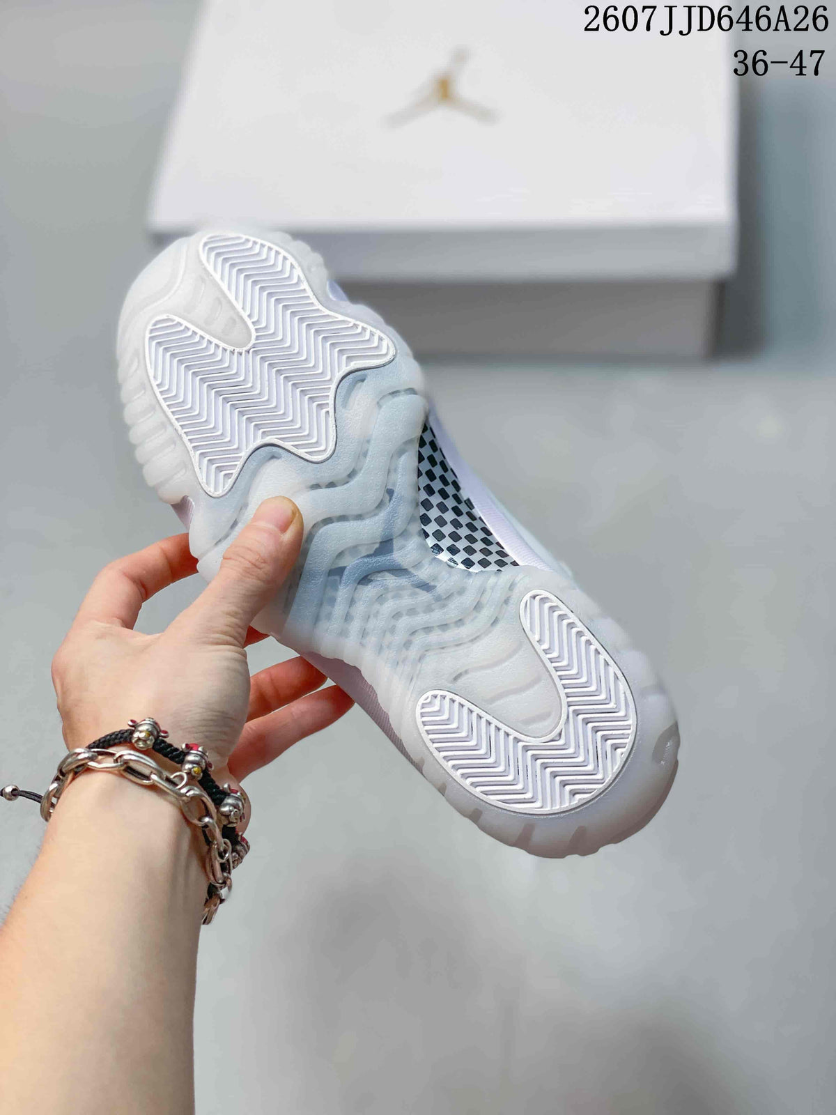 Close view of the translucent outsole with white herringbone traction sections and a patterned midfoot panel.