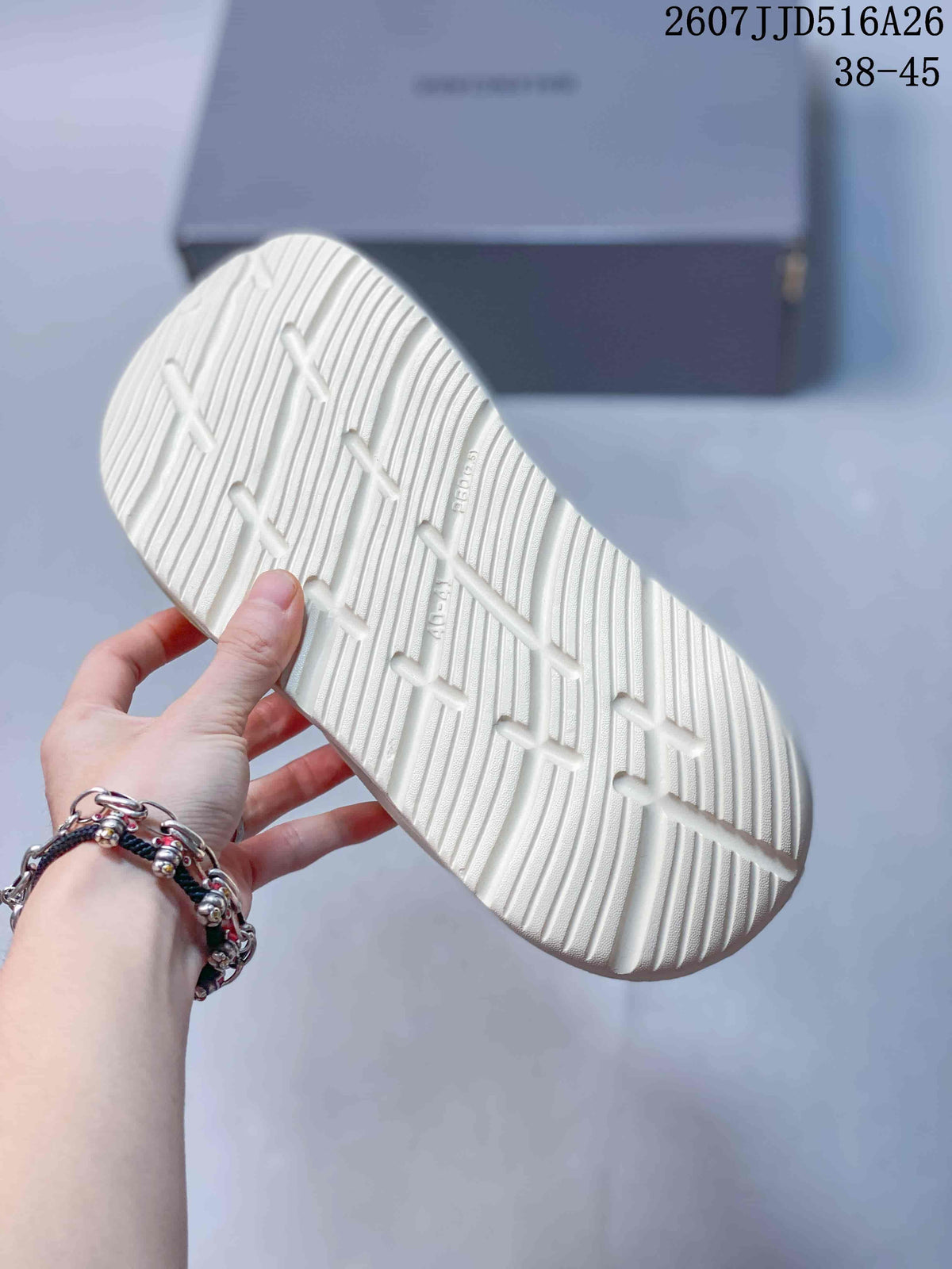 Close-up of the textured outsole showing raised tread lines and geometric traction grooves.