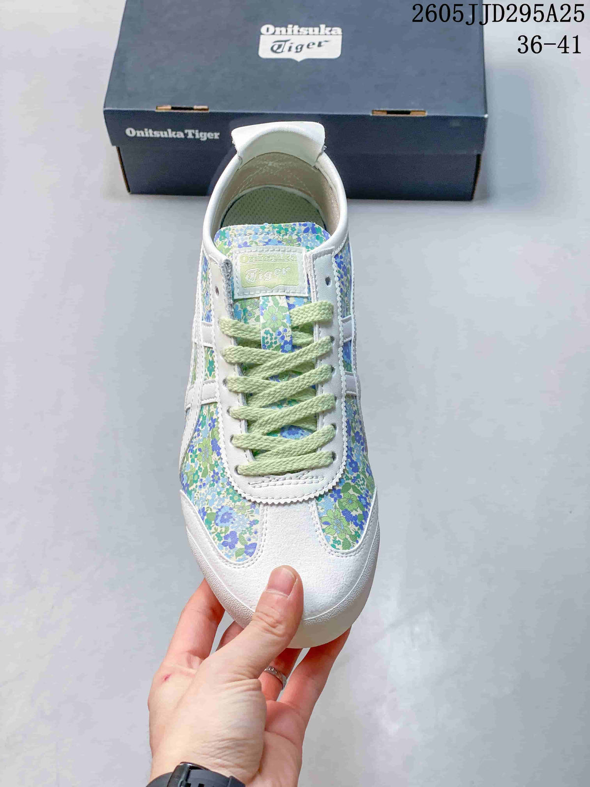 Top view showing the floral toe box, pale green laces, and white overlays.