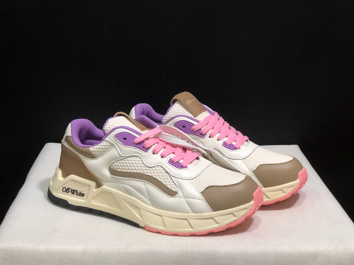 Three-quarter front view of the pair with white uppers, beige overlays, pink laces, purple collars, and cream midsoles.