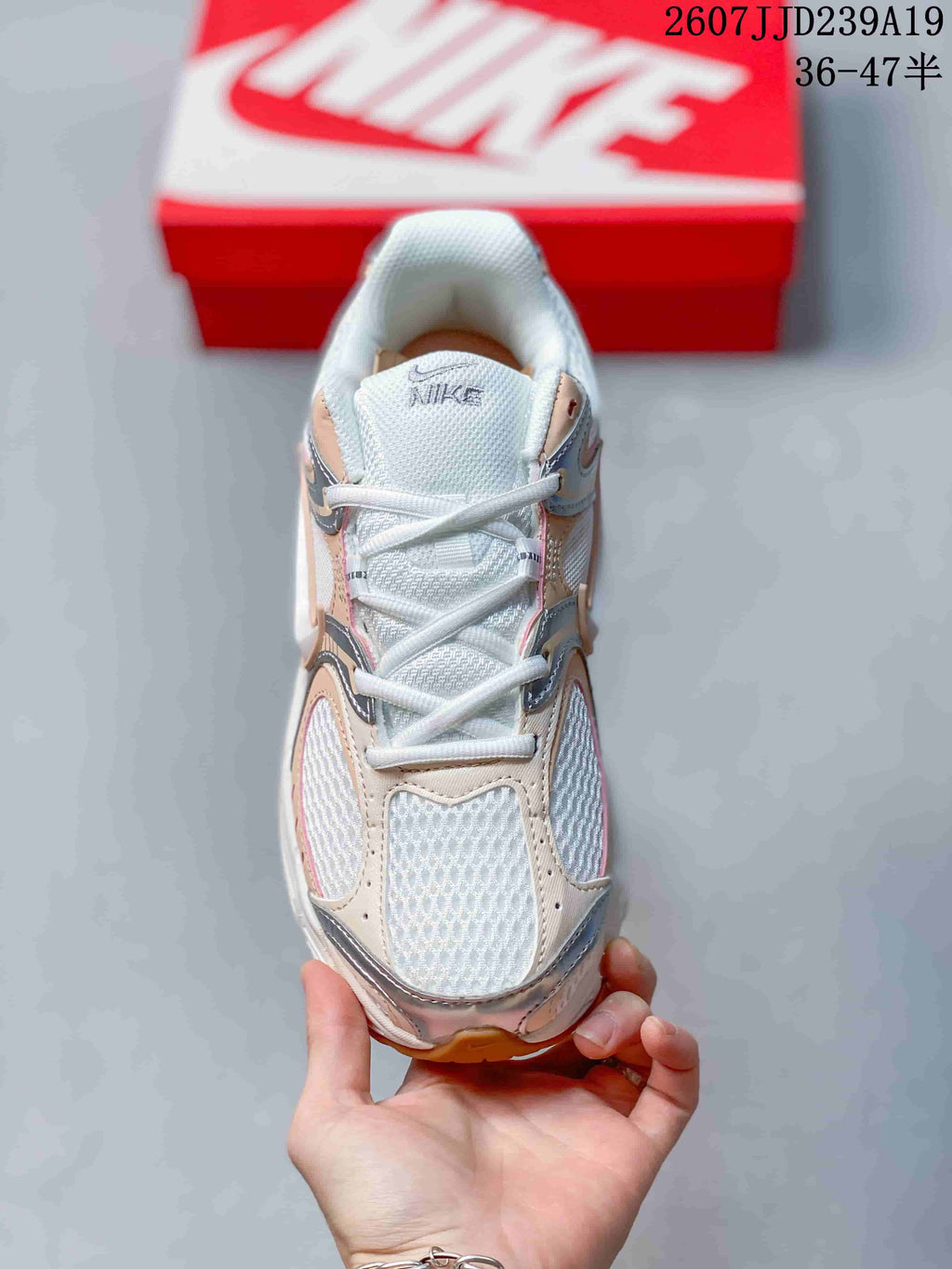 Top view showing the mesh toe box, white laces, padded tongue, and layered upper panels.